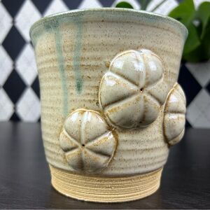Studio Pottery Raised Floral Medallion Speckled Glaze Cream and Green Stoneware